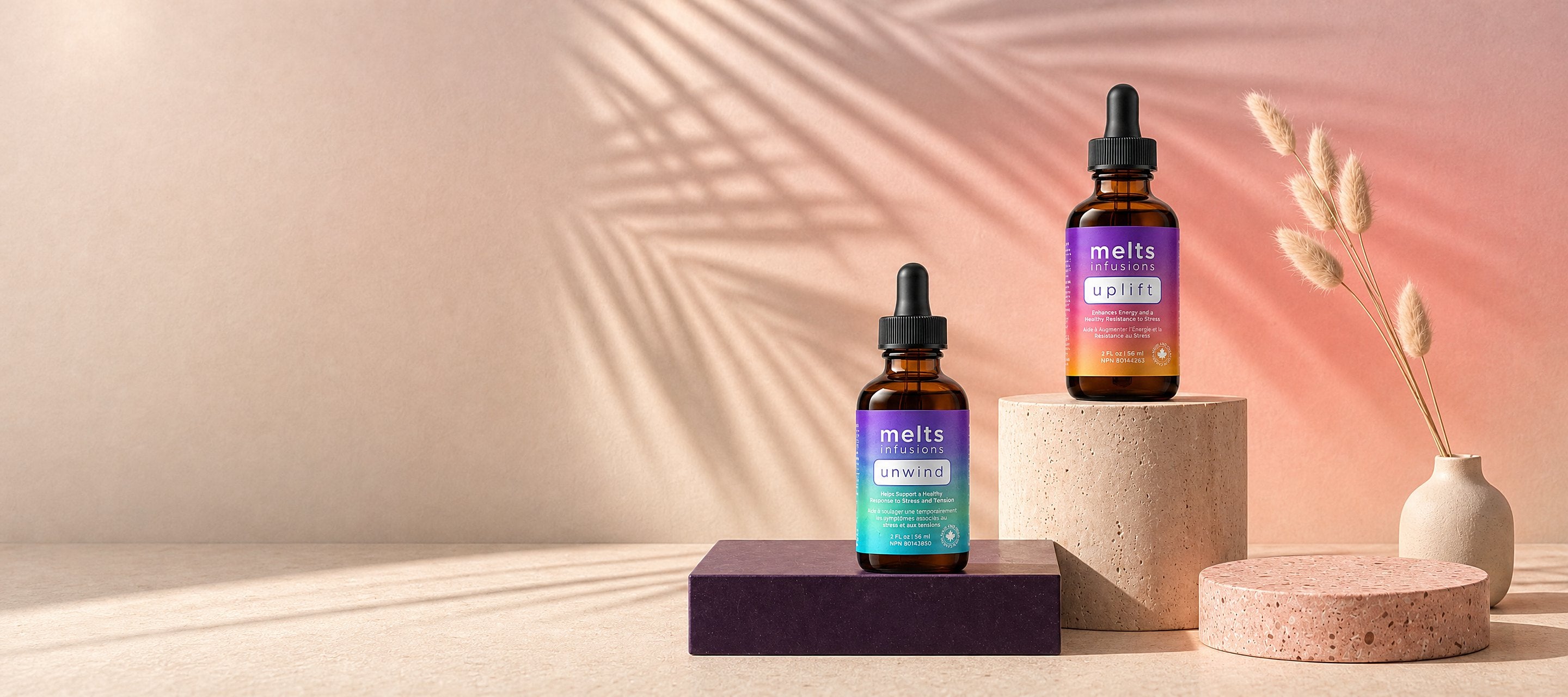 UPLIFT and UNWIND tinctures on sunlit stone